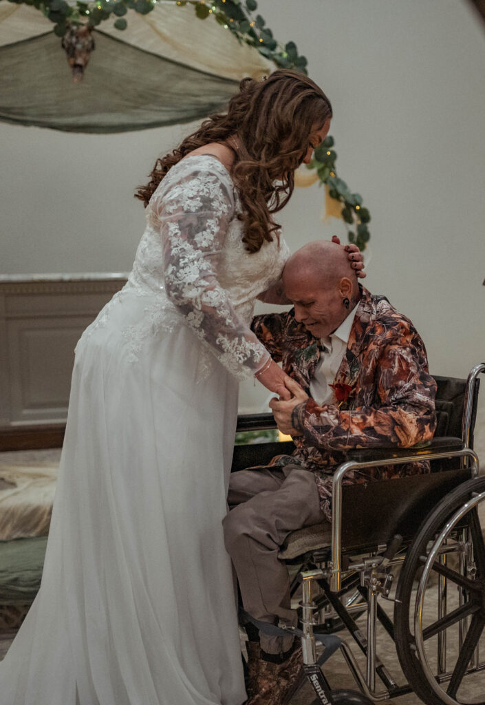 Bride and Groom sharing a emotional moment during their ceremony in Central Texas Abilene Wedding Venue captured by Central Texas Wedding Photographer The Bluebonnet Studio