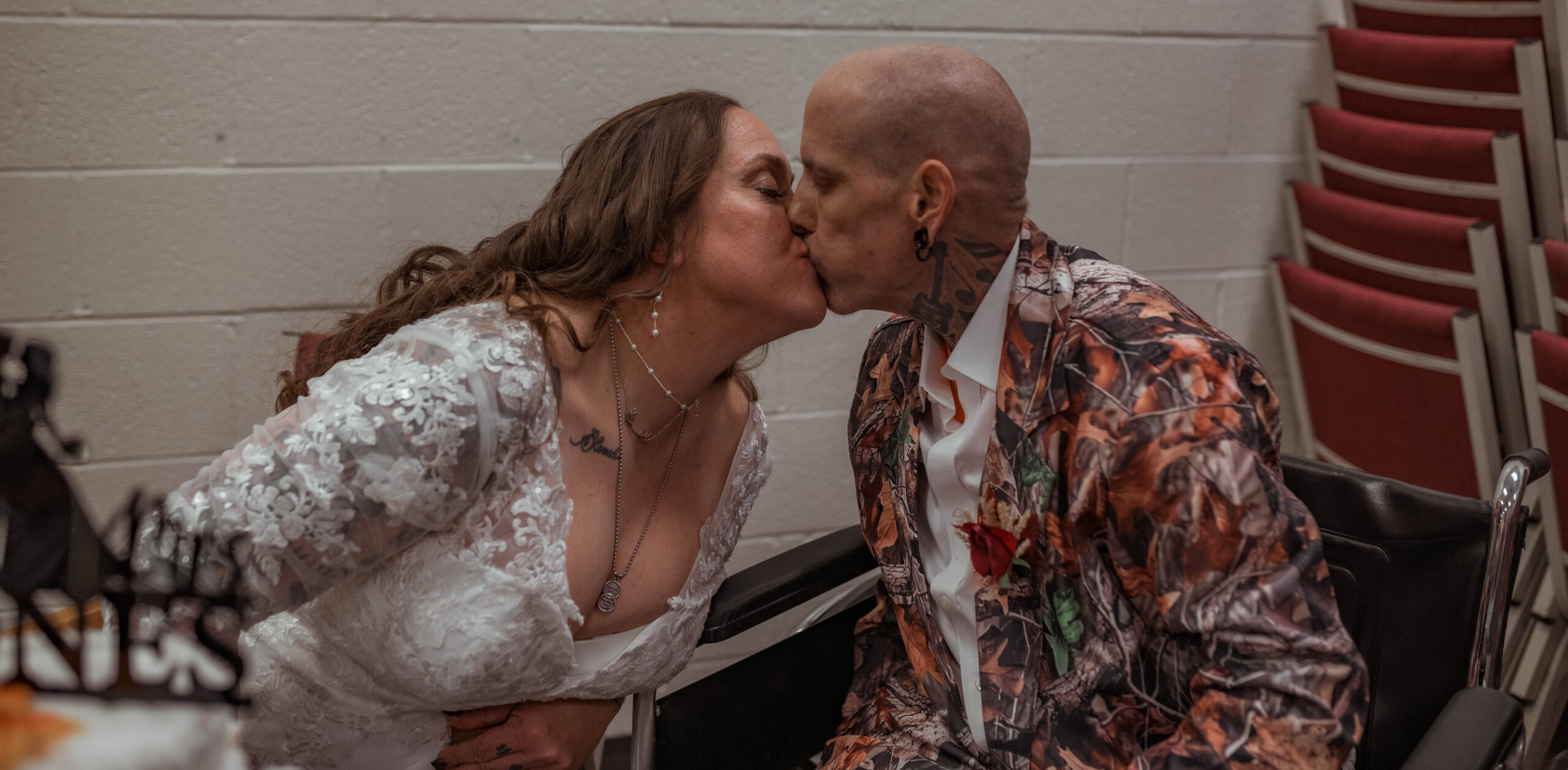 Bride and Groom sharing a kiss during their reception in Central Texas Wedding Venue captured by Central Texas Wedding Photographer The Bluebonnet Studio